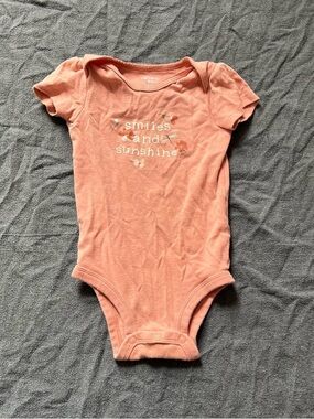Carter's pink baby girl onesie with "smiles and sunshine"